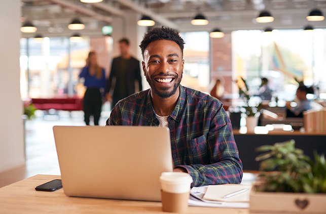 Man smiling at dentist during Invisalign consultation